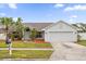 Charming single-story home with landscaped yard and two-car garage at 2615 Cobalt Ct, Orlando, FL 32837