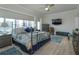 Main bedroom with a metal bed frame and a large TV at 100 S Eola Dr # 1401, Orlando, FL 32801