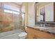 Bright bathroom with granite countertop, shower/tub combo, and updated vanity at 13412 Heswall Run, Orlando, FL 32832