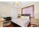 Cozy bedroom with hardwood floors, a queen-size bed, and ample closet space at 13412 Heswall Run, Orlando, FL 32832