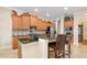 Kitchen with granite island, custom cabinetry, and breakfast bar at 13412 Heswall Run, Orlando, FL 32832