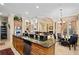 Island kitchen with granite counters and stainless steel appliances at 13412 Heswall Run, Orlando, FL 32832