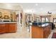 Large kitchen with an island, granite countertops, and ample cabinet space at 13412 Heswall Run, Orlando, FL 32832
