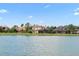 Waterfront view of the lake and houses from across the water at 13412 Heswall Run, Orlando, FL 32832