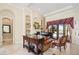 Open living room with built-in shelving, a fireplace, and access to a pool at 13412 Heswall Run, Orlando, FL 32832