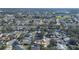 Aerial image showcasing a neighborhood with houses and surrounding landscape at 1511 Oak Hill Trl, Kissimmee, FL 34747