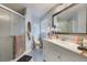 Updated bathroom with a white vanity and walk-in shower at 1511 Oak Hill Trl, Kissimmee, FL 34747