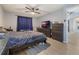 Spacious bedroom with a large bed, dresser, and TV at 1511 Oak Hill Trl, Kissimmee, FL 34747