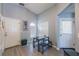 Bright dining area with table and benches, near kitchen and entryway at 1511 Oak Hill Trl, Kissimmee, FL 34747