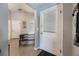 Entryway with white door and small table and bench at 1511 Oak Hill Trl, Kissimmee, FL 34747