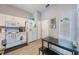 White kitchen with appliances and a small table at 1511 Oak Hill Trl, Kissimmee, FL 34747