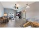 Living room with sectional sofa, TV stand, and pool view at 1511 Oak Hill Trl, Kissimmee, FL 34747