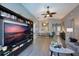 Living area with sectional sofa and built-in shelving at 1511 Oak Hill Trl, Kissimmee, FL 34747