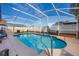 Relaxing screened pool with patio and lounge chairs at 1511 Oak Hill Trl, Kissimmee, FL 34747