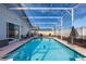 Refreshing screened pool and patio furniture at 1511 Oak Hill Trl, Kissimmee, FL 34747