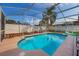 Inviting screened pool with patio furniture at 1511 Oak Hill Trl, Kissimmee, FL 34747