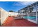 Brick patio with lounge chairs near the pool at 1511 Oak Hill Trl, Kissimmee, FL 34747
