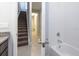 Bathroom with tub and view of staircase at 223 Cherokee Hill, Deland, FL 32724