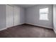 Simple bedroom with carpet and double doors at 223 Cherokee Hill, Deland, FL 32724
