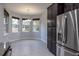 Breakfast nook with tile floor, large windows, and view of backyard at 223 Cherokee Hill, Deland, FL 32724