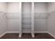 Spacious walk-in closet with wire shelving and hanging rods at 223 Cherokee Hill, Deland, FL 32724