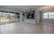 Open concept dining area with view of kitchen and backyard access at 223 Cherokee Hill, Deland, FL 32724