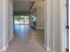 Tiled entryway with view into the living room and kitchen at 223 Cherokee Hill, Deland, FL 32724