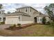 Two-story house with gray siding, a two-car garage, and landscaping at 223 Cherokee Hill, Deland, FL 32724