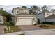 Two-story house with gray siding, a two-car garage, and landscaping at 223 Cherokee Hill, Deland, FL 32724
