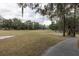 View of a lush green golf course with trees and walking path at 223 Cherokee Hill, Deland, FL 32724