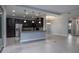 Open concept kitchen with island, stainless steel appliances, and breakfast bar at 223 Cherokee Hill, Deland, FL 32724