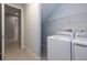 Laundry room with washer, dryer, and shelving at 223 Cherokee Hill, Deland, FL 32724