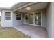 Covered patio with paver stones and view of backyard at 223 Cherokee Hill, Deland, FL 32724