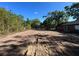 Serene and expansive cleared lot surrounded by beautiful trees, ready for your dream home at 25122 Ensley Rd, Sorrento, FL 32776