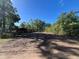 Spacious, cleared lot awaiting construction with lush, mature trees in a desirable location at 25122 Ensley Rd, Sorrento, FL 32776