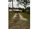 Gravel driveway leading to a single-Gathering home at 2706 10Th St, Orlando, FL 32820