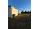 Side of house with grassy yard and grill at 2706 10Th St, Orlando, FL 32820