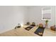 Relaxing yoga room with hardwood floors and mats at 3032 Ella Way, St Cloud, FL 34771