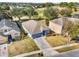 Aerial view of house, yard, and surrounding neighborhood at 33931 Terragona Dr, Sorrento, FL 32776