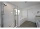 Bathroom with walk-in shower, garden tub, and grey floor at 3439 Feathergrass Ct, Harmony, FL 34773