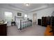 Main bedroom with metal bed frame and ensuite bathroom access at 3439 Feathergrass Ct, Harmony, FL 34773