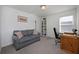 Bedroom with sofa, home office setup, and built-in shelving at 3439 Feathergrass Ct, Harmony, FL 34773