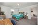 Bedroom with a wooden bed frame and built-in shelves at 3439 Feathergrass Ct, Harmony, FL 34773