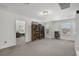 Spacious bonus room with carpeted floor, two windows, and built-in shelving at 3439 Feathergrass Ct, Harmony, FL 34773