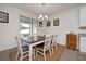 Bright dining room with table and chairs, and access to backyard at 3439 Feathergrass Ct, Harmony, FL 34773