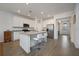 Spacious kitchen with white cabinets, stainless steel appliances, and an island at 3439 Feathergrass Ct, Harmony, FL 34773