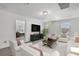 Living Room with two armchairs, a coffee table, and a TV at 3439 Feathergrass Ct, Harmony, FL 34773