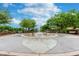 Community water fountain with benches and landscaping at 3439 Feathergrass Ct, Harmony, FL 34773