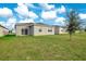 Large backyard with grassy area and surrounding houses visible at 3482 Forster Ave, Leesburg, FL 34748