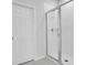 Clean bathroom with a shower and a white door at 3482 Forster Ave, Leesburg, FL 34748